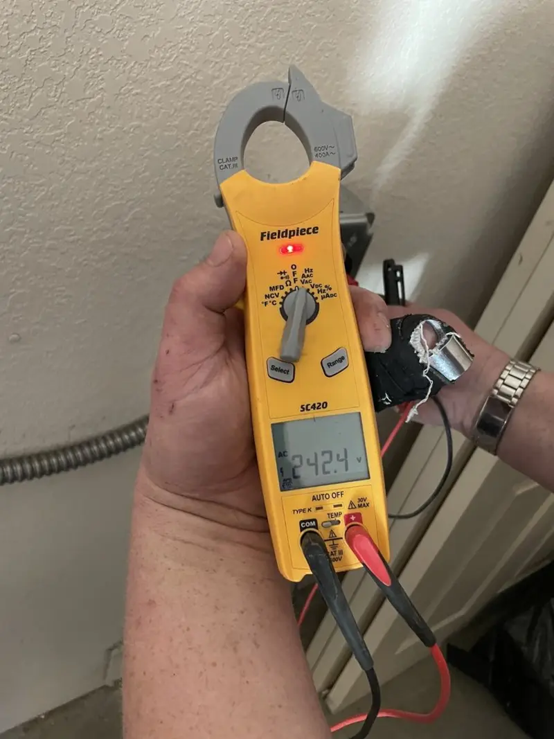 Voltage testing with clamp meter during Recessed Lighting Installation in Maple Shade